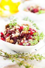 boiled beets with walnuts, salad in a small salad bowl