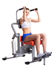 Fototapeta premium Sporty woman doing exercises on trainer