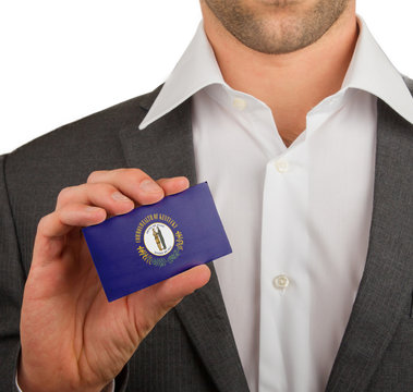 Businessman is holding a business card, Kentucky