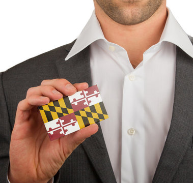 Businessman is holding a business card, Maryland