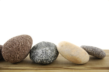 Fototapeta na wymiar Set of colored stones on a wood board
