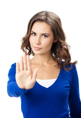 Serious woman with stop gesture, isolated