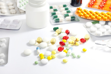 Medication and pills on white background