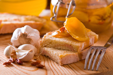 Sliced bread with peppers under oil.