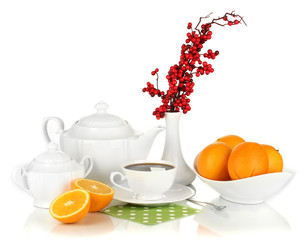 Beautiful white dinner service with oranges isolated on white