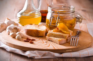 Sliced bread with peppers under oil.