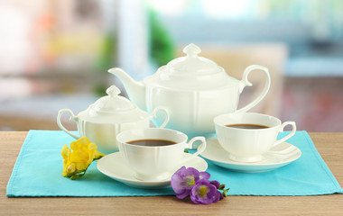 Beautiful tea service on wooden table
