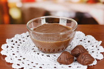 Bowl of chocolate and sweets on table in cafe