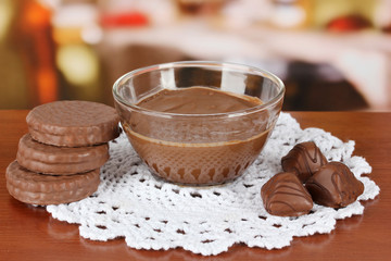 Bowl of chocolate and sweets on table in cafe