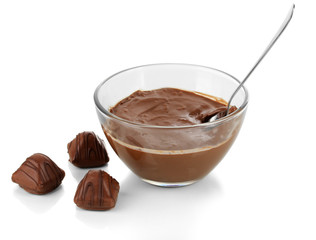 Bowl of chocolate and sweets isolated on white
