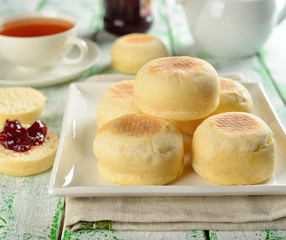 Traditional English muffins on a white table