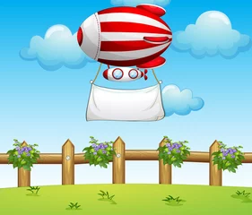 Poster Een gestreepte luchtballon met een lege banier © GraphicsRF