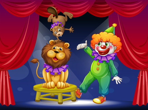 A clown with animals at the stage