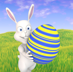 Cute easterbunny carrying an big easter egg
