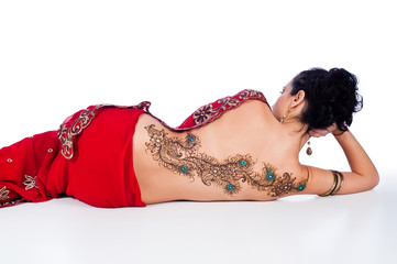 Woman in a Red Sari with Henna Design on her Back