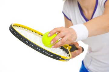 Closeup on tennis player ready to serve ball
