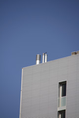 Building with chimney under blue sky