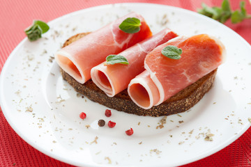 slices of delicious ham rolled into a tube on a plate