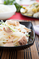 appetizing rice noodles with chunks of tuna