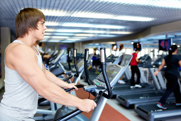 Fototapeta na wymiar Man on the treadmill