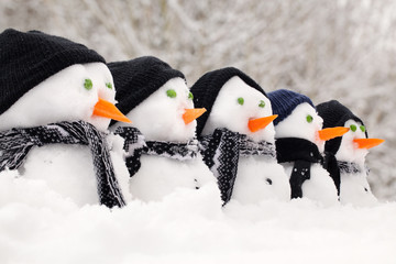 Snowmen close up in a row