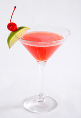 red cocktail with lime