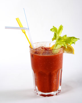 Fresh tomato juice with ice in a glass