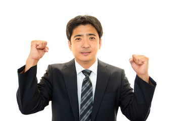 ガッツポーズのビジネスマン