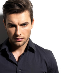 Fashion portrait of young man in black shirt