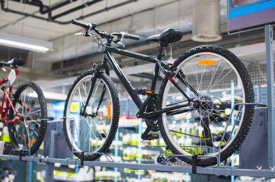 Bicicles examples on stands in sport store