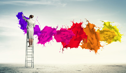 Young woman drawing splashes