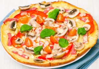 pizza with mushrooms, ham and vegetables