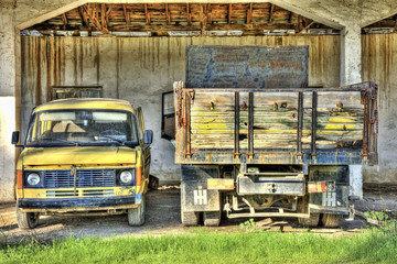 Abandoned van and truck in a shed