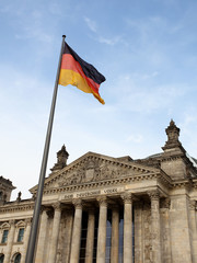 Reichstag in Berlin wih German flag