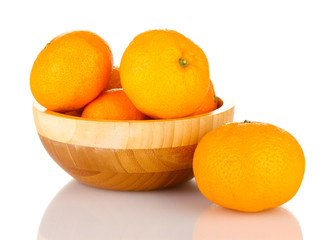 Tasty mandarines  in wooden bowl isolated on white