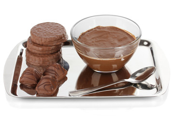 Bowl of chocolate and sweets isolated on white