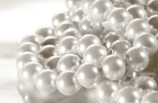 White pearl on reflective surface