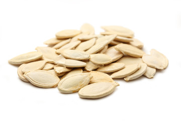 Pumpkin seeds on the white background