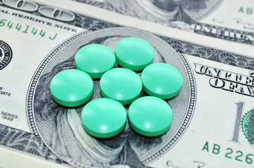 Доллары и зелёные таблетки.