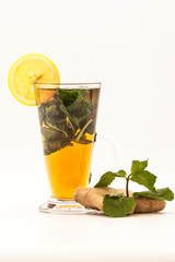 Cup tea with mint and lemon isolated on a white background