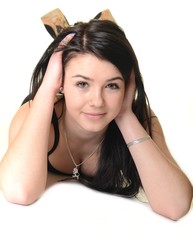 Pretty young woman lying over white background