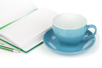 Coffee cup and office supplies