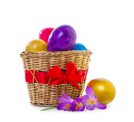 Fototapeta na wymiar Easter eggs in a wicker basket