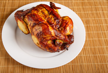 Roast Chicken at Angle on White Plate