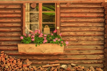 Fototapeta na wymiar Small wooden cottage with window