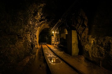 Fototapeta na wymiar Underground mine passage with rails