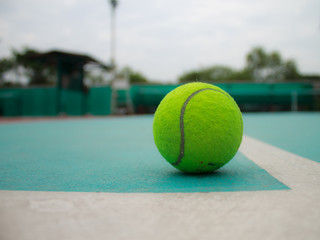 A tennis ball on court