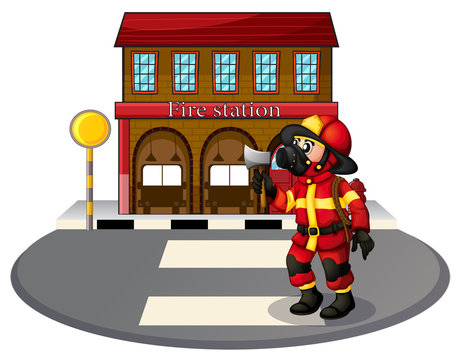 A fireman in front of the fire station