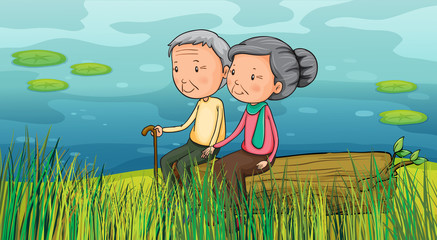 Deux personnes âgées assises près du lac