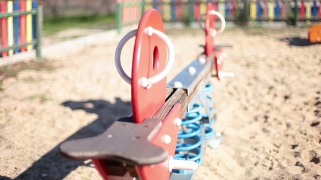 Colorful play equipment in the sand on a playground
